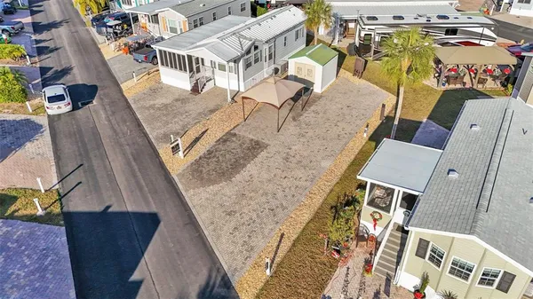 an aerial view of residential houses with outdoor space