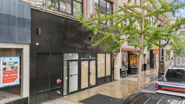 a patio with a table and chairs