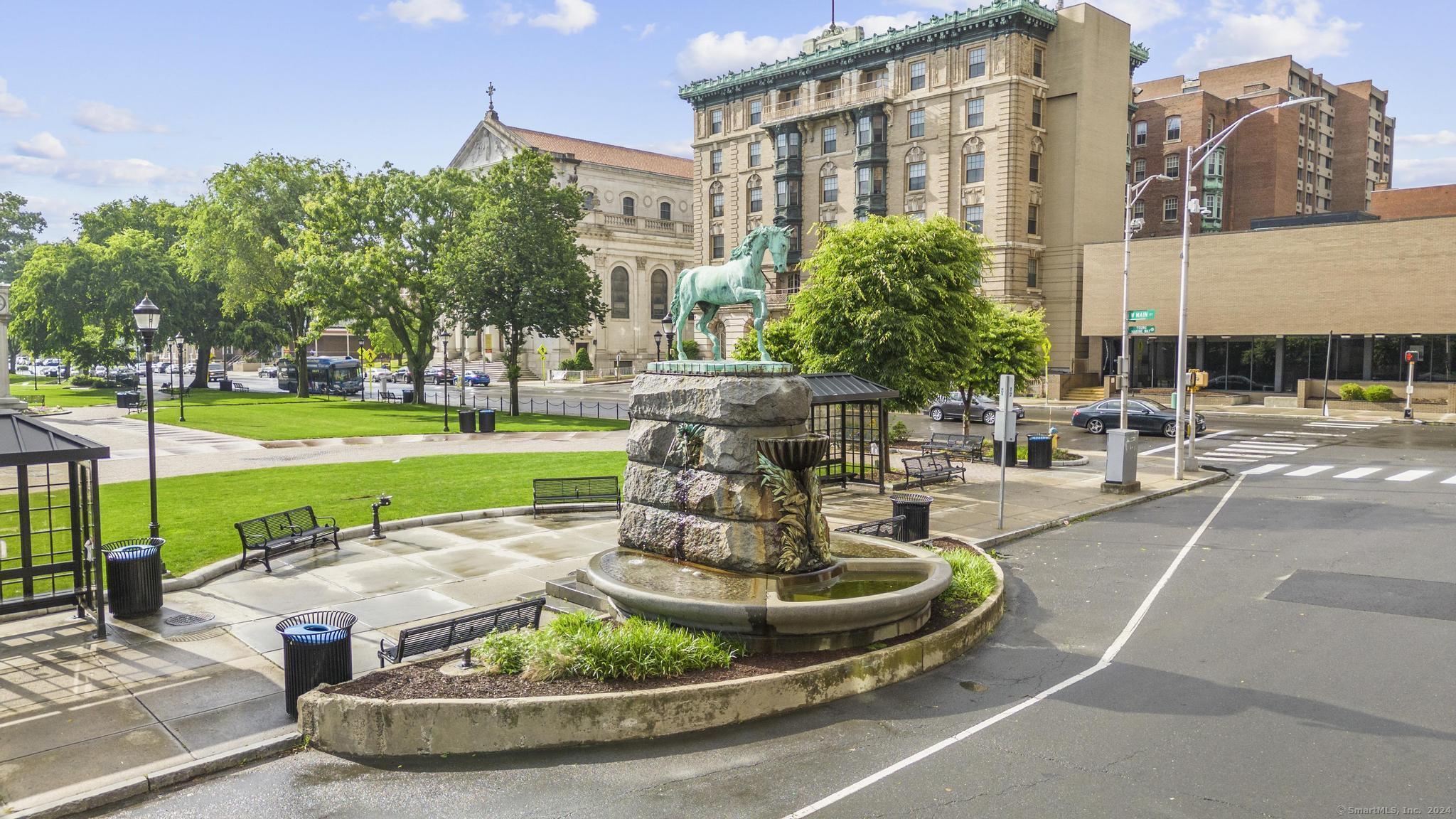 111 Bank Street, Unit 2B Waterbury, CT 06702 - Photo 13 of 15 a patio with a table and chairs