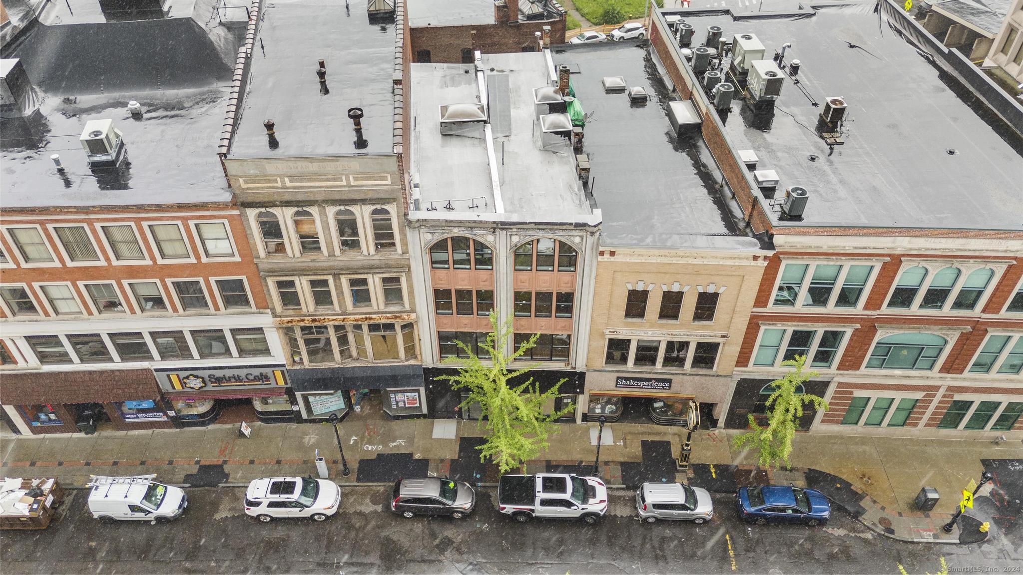 111 Bank Street, Unit 2B Waterbury, CT 06702 - Photo 14 of 15 a front view of a building with glass windows