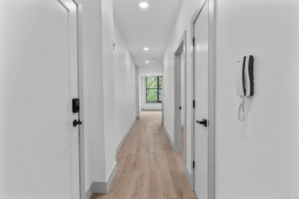 a bathroom with a granite countertop toilet a shower and a sink