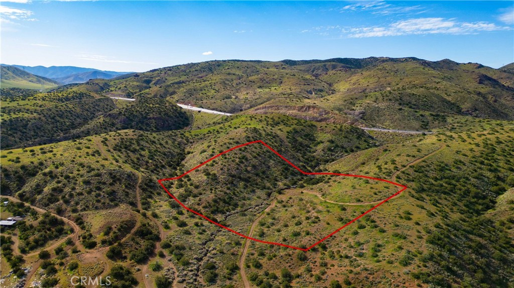 0 Courson Ranch Road Palmdale, CA 93550 - Photo 3 of 12 a view of a mountain range with a lush green hillside
