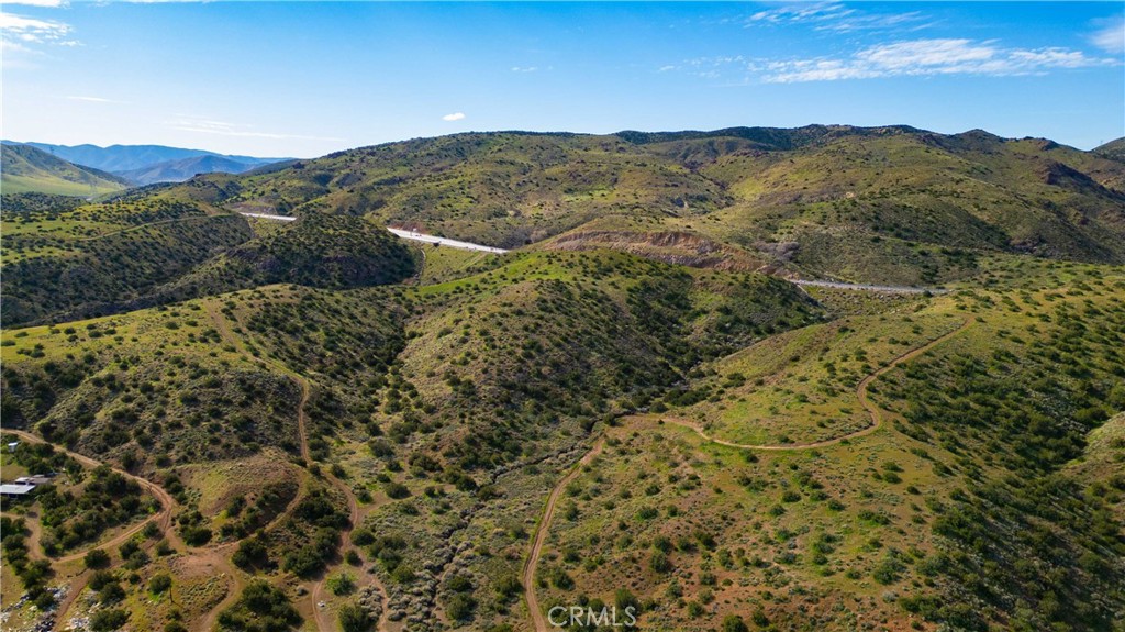 0 Courson Ranch Road Palmdale, CA 93550 - Photo 4 of 12 a view of a mountain range with a lush green hillside