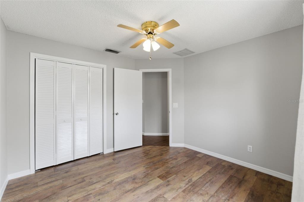 4966 Keysville Avenue Spring Hill, FL 34608 - Photo 34 of 48 a view of an empty room with wooden floor