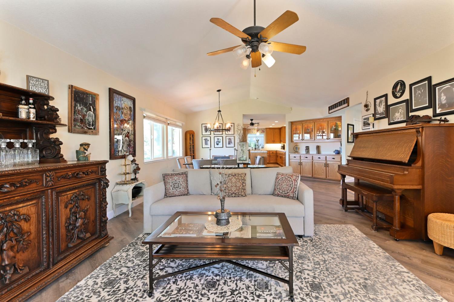 234 Mistletoe Court Angels Camp, CA 95222 - Photo 16 of 80 a living room with furniture a rug and a chandelier