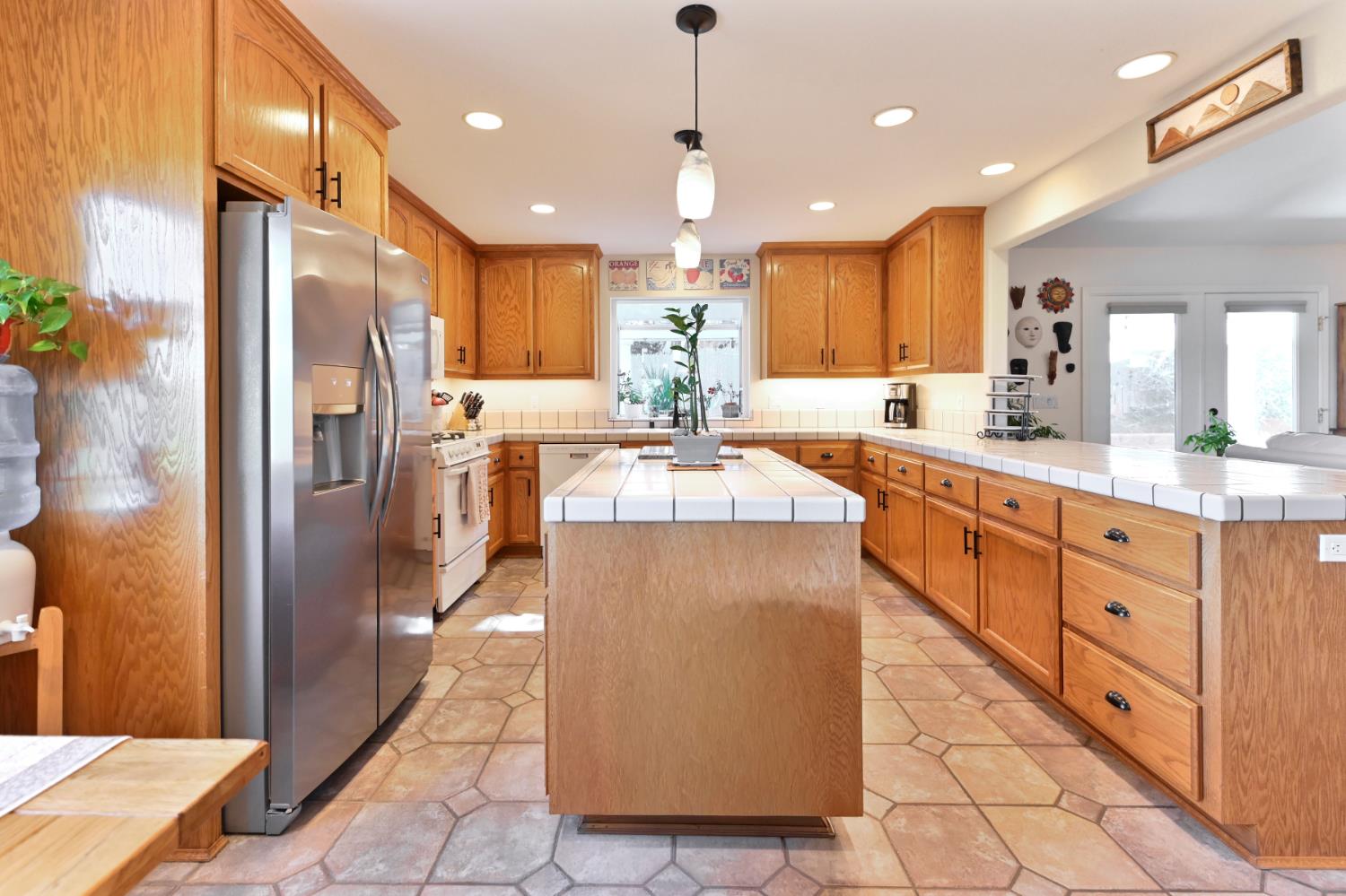 234 Mistletoe Court Angels Camp, CA 95222 - Photo 23 of 80 a large kitchen with kitchen island a island a sink stainless steel appliances and cabinets