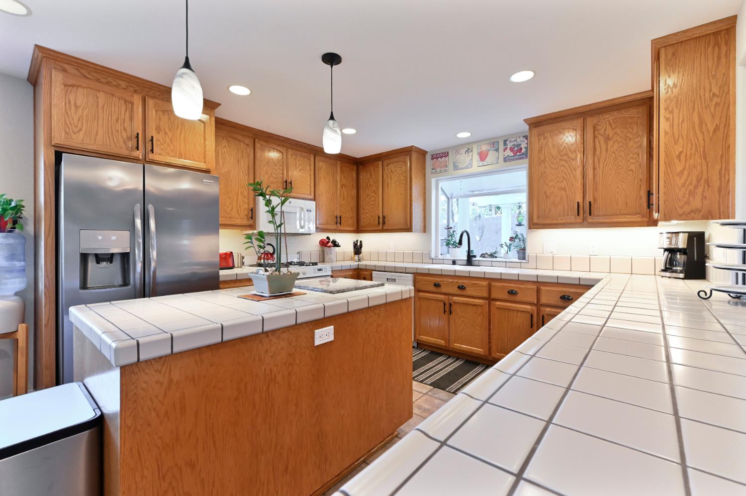 234 Mistletoe Court Angels Camp, CA 95222 - Photo 24 of 80 a kitchen with stainless steel appliances granite countertop a sink a counter space and cabinets