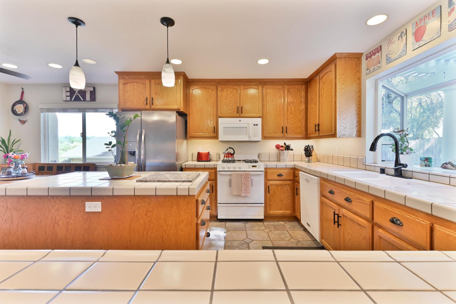 234 Mistletoe Court Angels Camp, CA 95222 - Photo 25 of 80 a kitchen with a sink window and stainless steel appliances