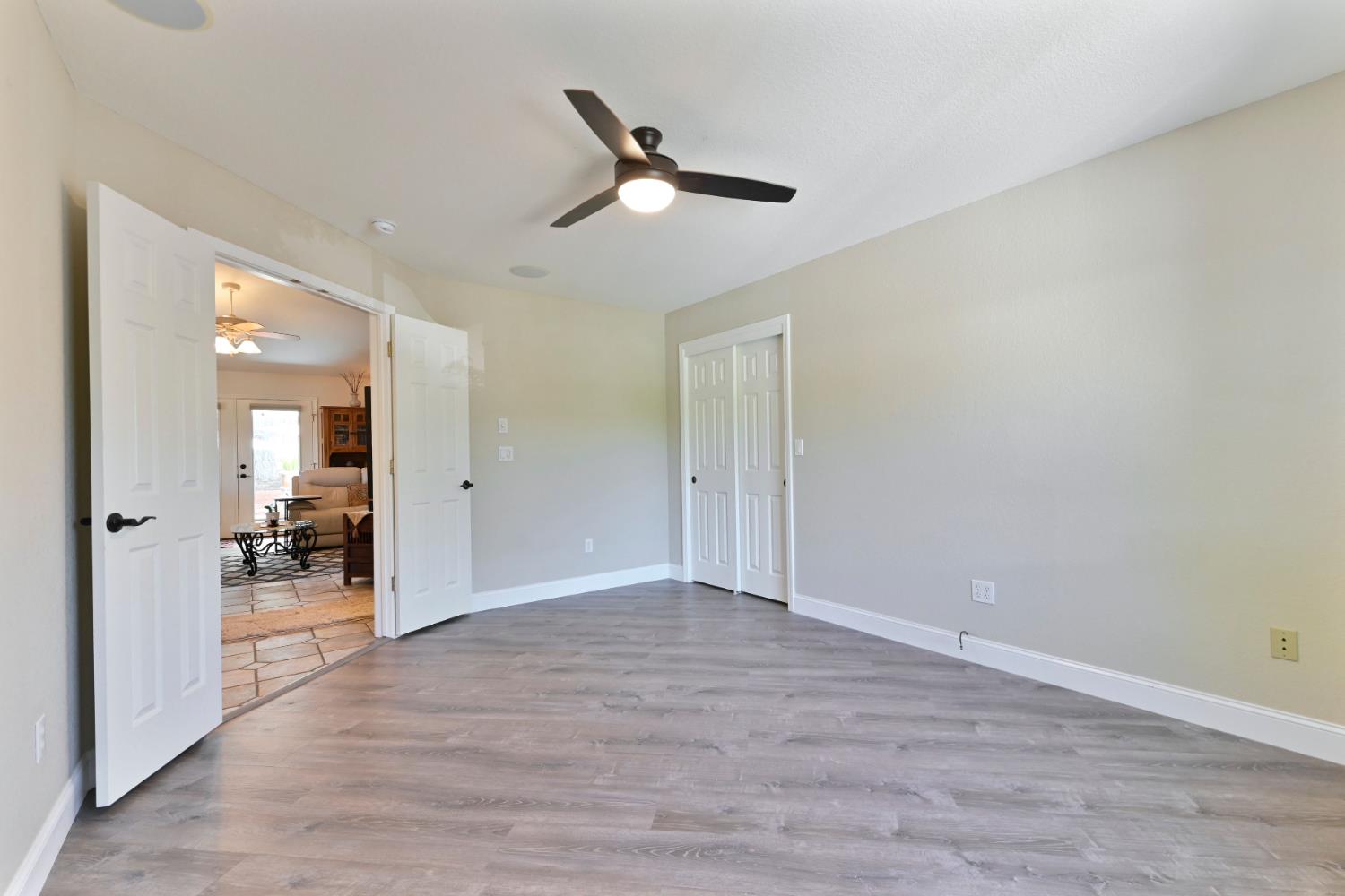 234 Mistletoe Court Angels Camp, CA 95222 - Photo 36 of 80 a view of a livingroom with a ceiling fan & entryway
