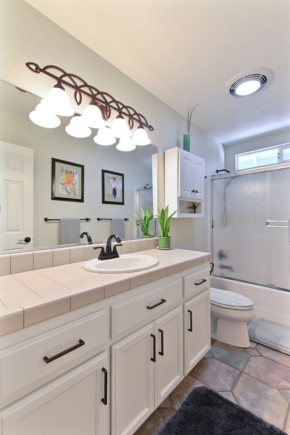 234 Mistletoe Court Angels Camp, CA 95222 - Photo 39 of 80 a spacious bathroom with a double vanity sink mirror and toilet