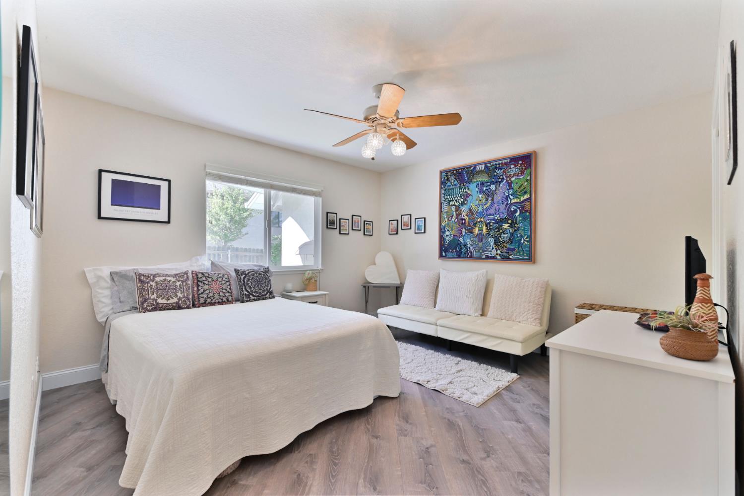 234 Mistletoe Court Angels Camp, CA 95222 - Photo 52 of 80 a bedroom with a large bed a couch and paintings on the wall
