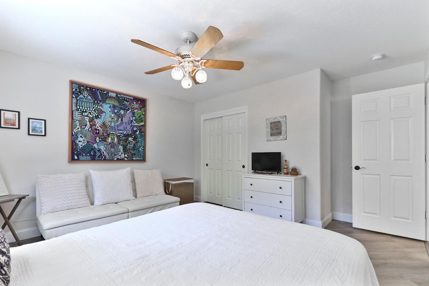 234 Mistletoe Court Angels Camp, CA 95222 - Photo 53 of 80 a bedroom with a bed and a chandelier