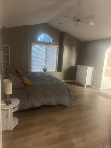 a bedroom with a bed and a toilet