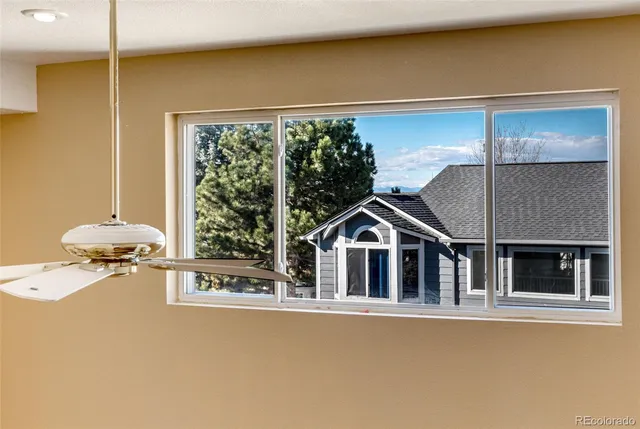 a view of a house with a porch and furniture