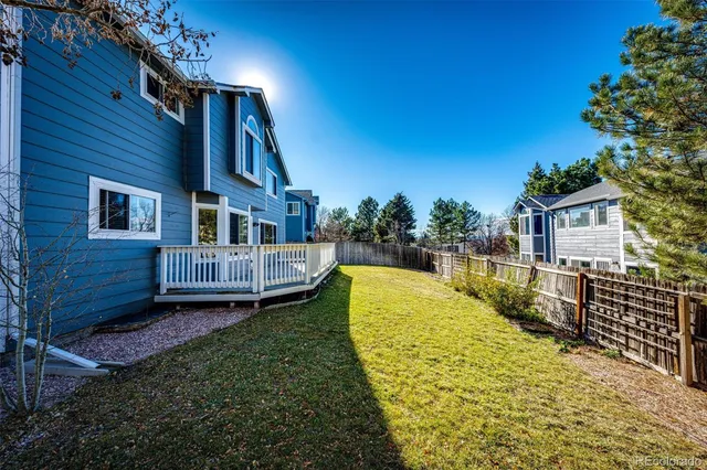a view of a house with pool and sitting area