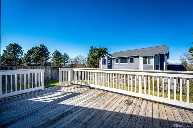 a balcony with wooden floor