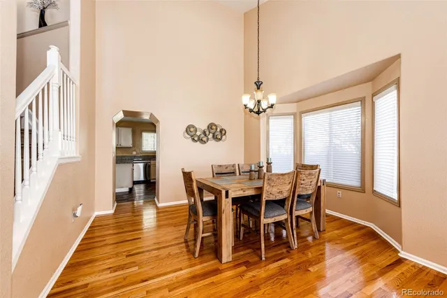 a view of a dining room with furniture window and wooden floor