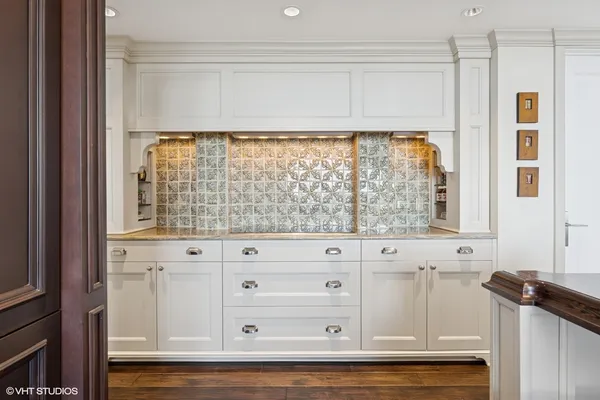 a view of white cabinet and mirror