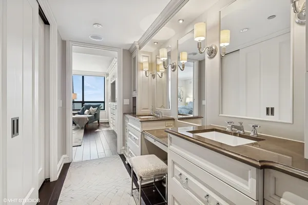 a bathroom with a sink double vanity and a mirror