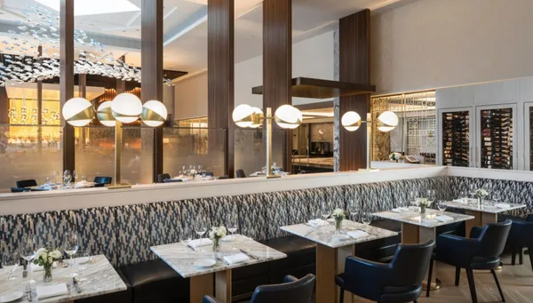 a view of a very nice looking dining room with furniture window and outside view