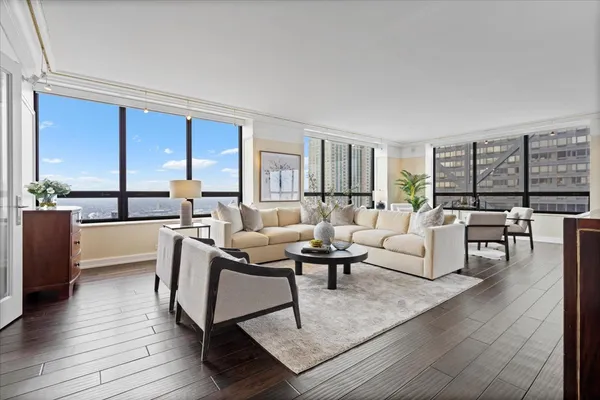 a living room with furniture and a table