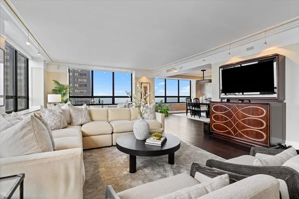 a living room with furniture and a flat screen tv