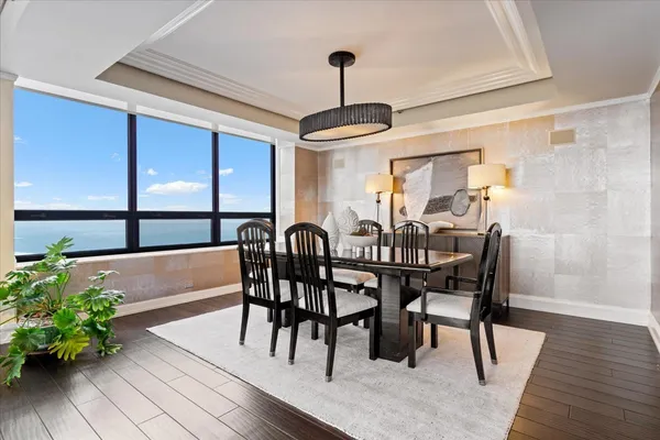 a view of a dining room with furniture window and wooden floor