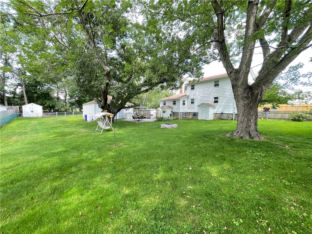 348 Market Street Warren, RI 02885 - Photo 50 of 50 Beautifully manicured 17,932 sq ft lot with fire pit area and fully fenced in is the perfect place to entertain your friends and family gatherings.