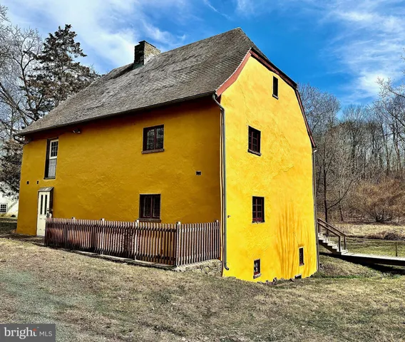 a view of a yard with large trees