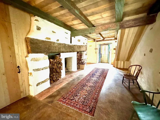 a view of a hallway with seating area