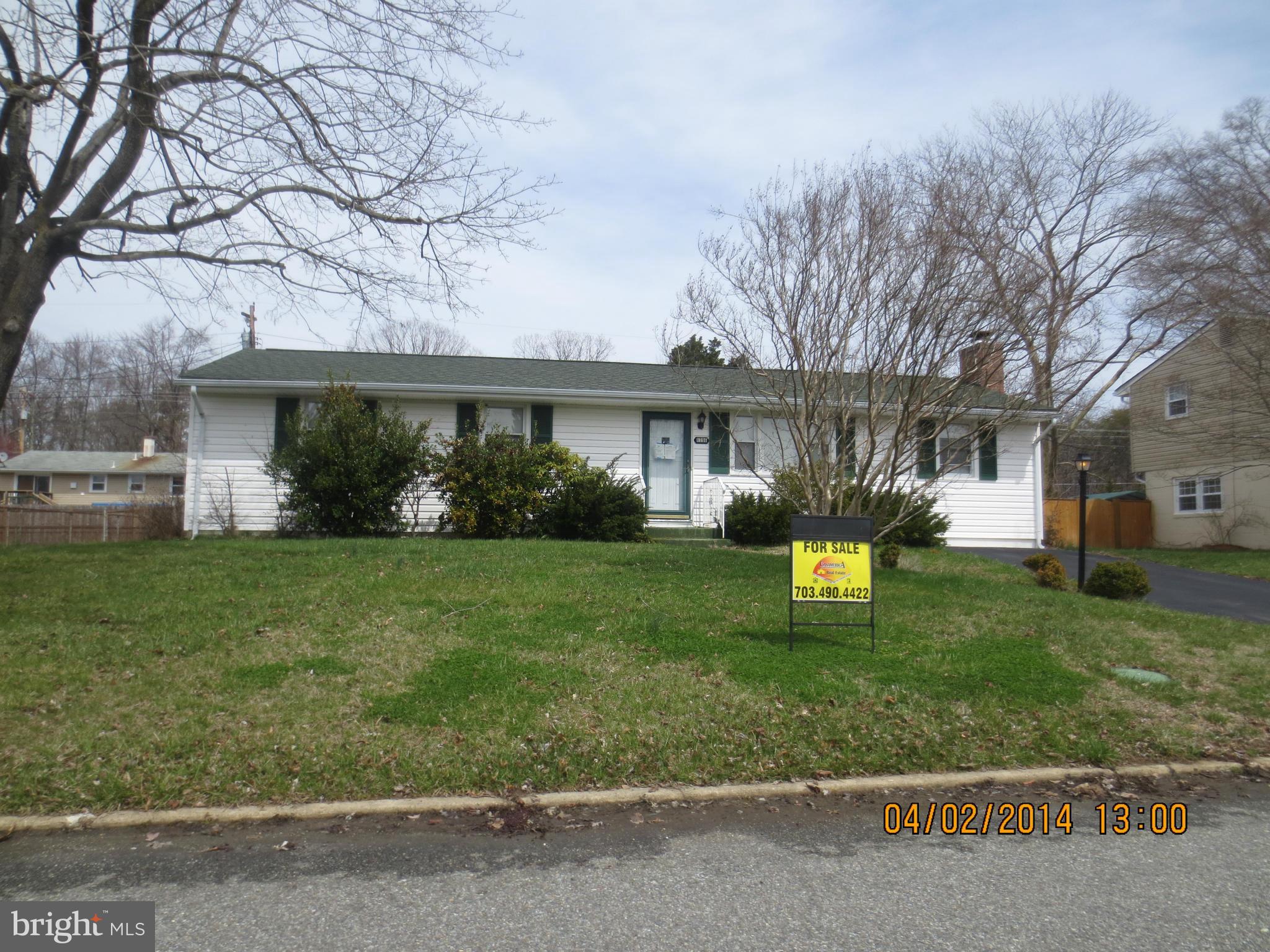 a view of a house with a yard porch and sitting area