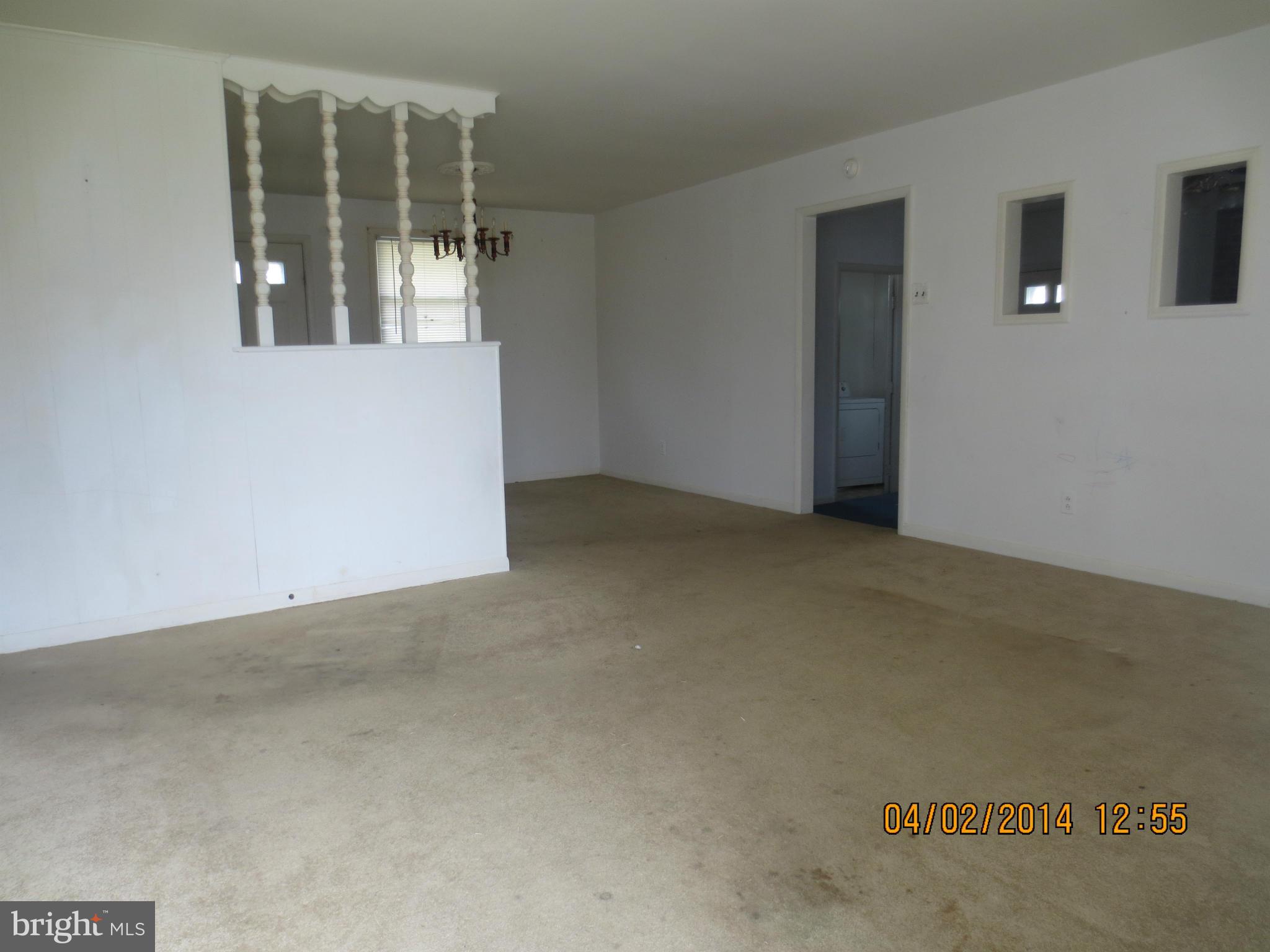 6796 Amherst Road Bryans Road, MD 20616 - Photo 2 of 10 an empty room with windows