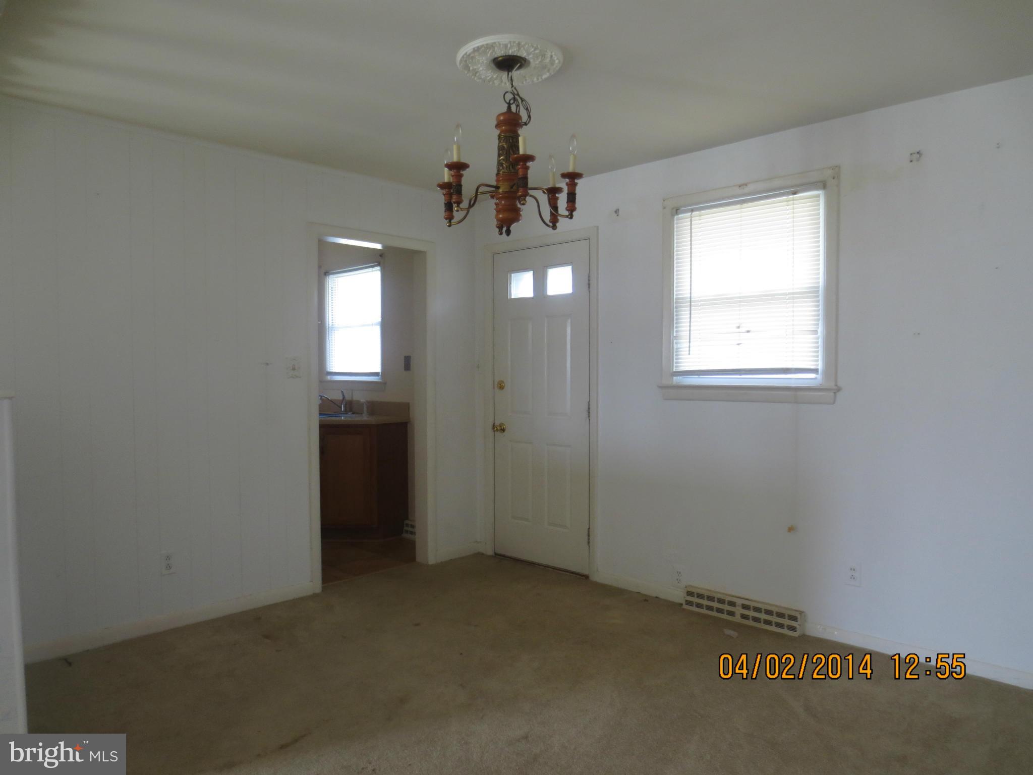 6796 Amherst Road Bryans Road, MD 20616 - Photo 5 of 10 an empty room with windows and entrance