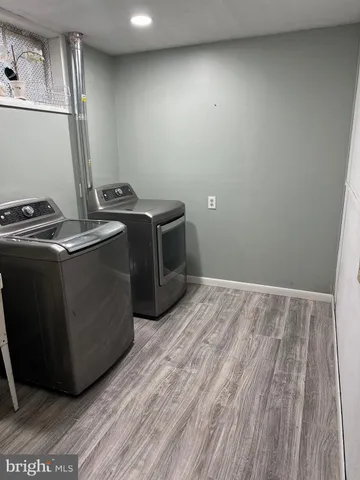 a view of hallway with wooden floor