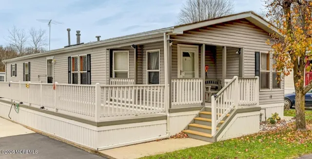 a front view of a house with a porch