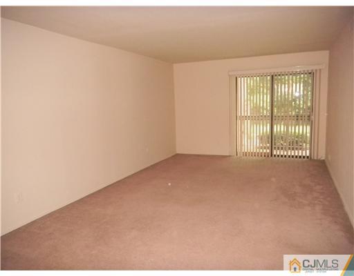 1938 Raspberry Court Edison, NJ 08817 - Photo 3 of 13 a view of an empty room with a window