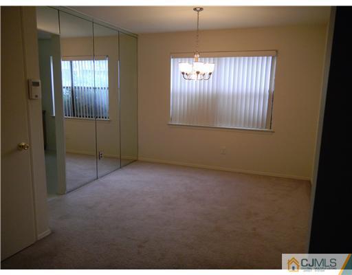 1938 Raspberry Court Edison, NJ 08817 - Photo 4 of 13 a view of an empty room with window and bathroom