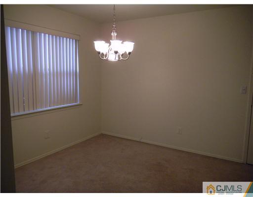 1938 Raspberry Court Edison, NJ 08817 - Photo 5 of 13 en empty room with windows