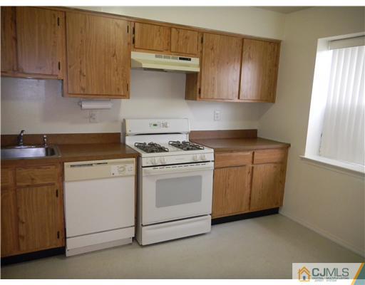 1938 Raspberry Court Edison, NJ 08817 - Photo 9 of 13 a kitchen with cabinets appliances and wooden floor