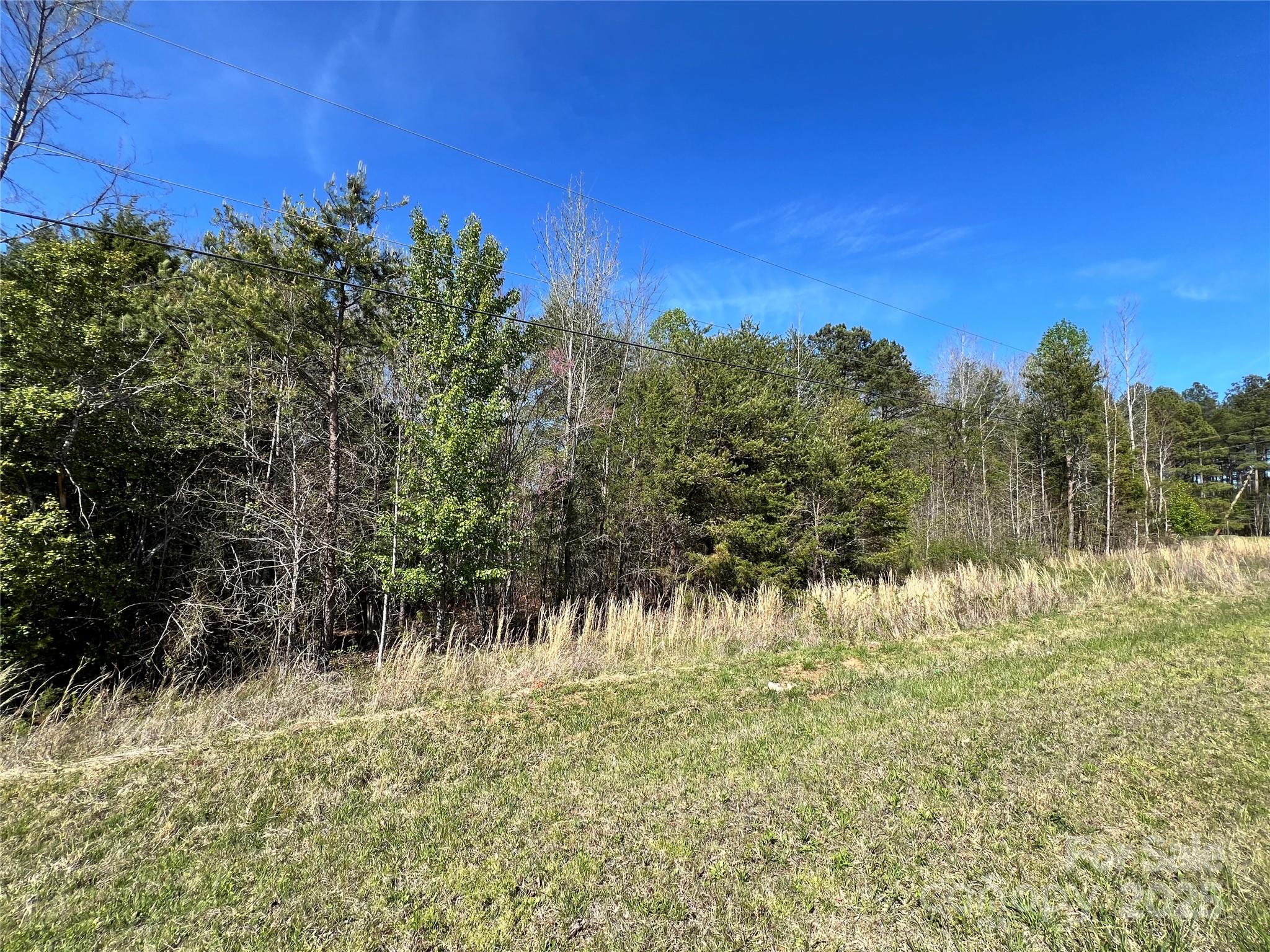 0 Fifth Creek Road Statesville, NC 28625 - Photo 32 of 43 a view of a lake with a mountain in the background