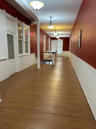 a view of a hall with stairs