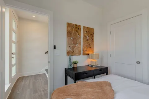 a bedroom with a bed and a table