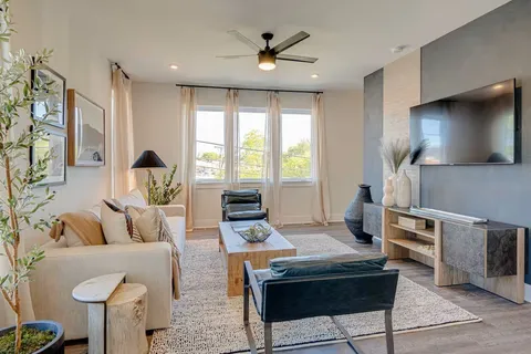 a living room with furniture and a window