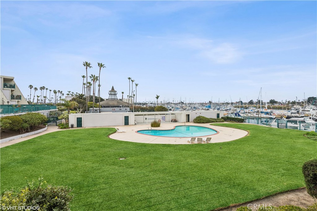 2901 Peninsula Road, Unit 138 Oxnard, CA 93035 - Photo 1 of 1 a swimming pool with outdoor seating and yard