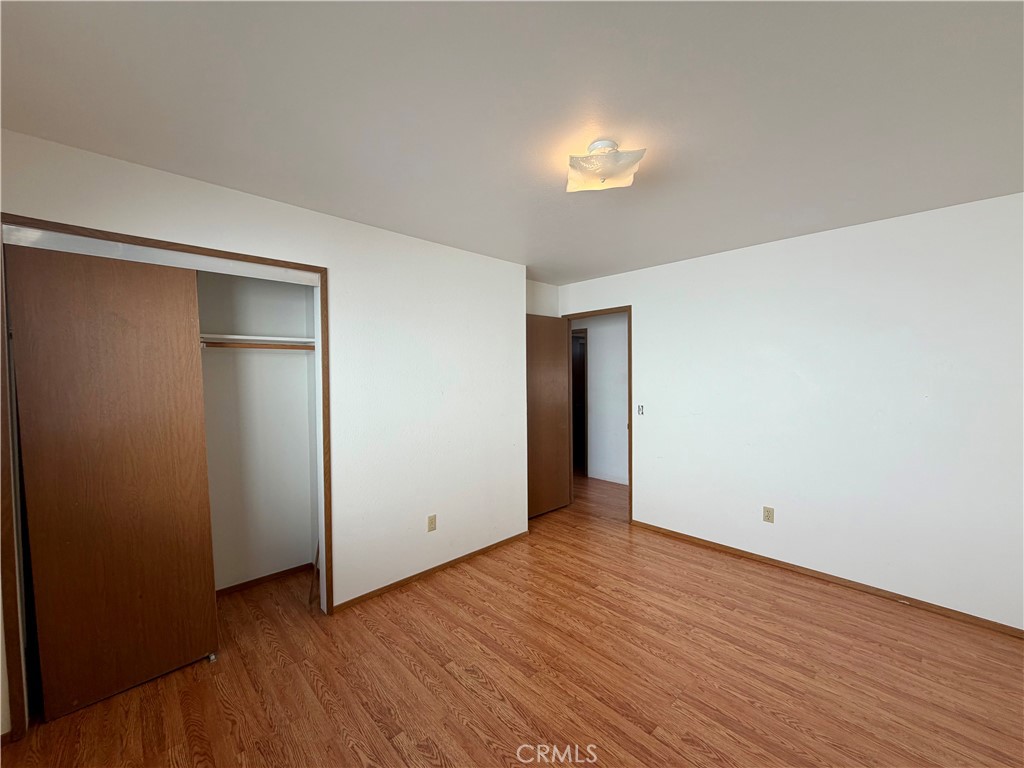 20764 Powder Horn Road Hidden Valley Lake, CA 95467 - Photo 12 of 27 a view of an empty room with wooden floor and a window