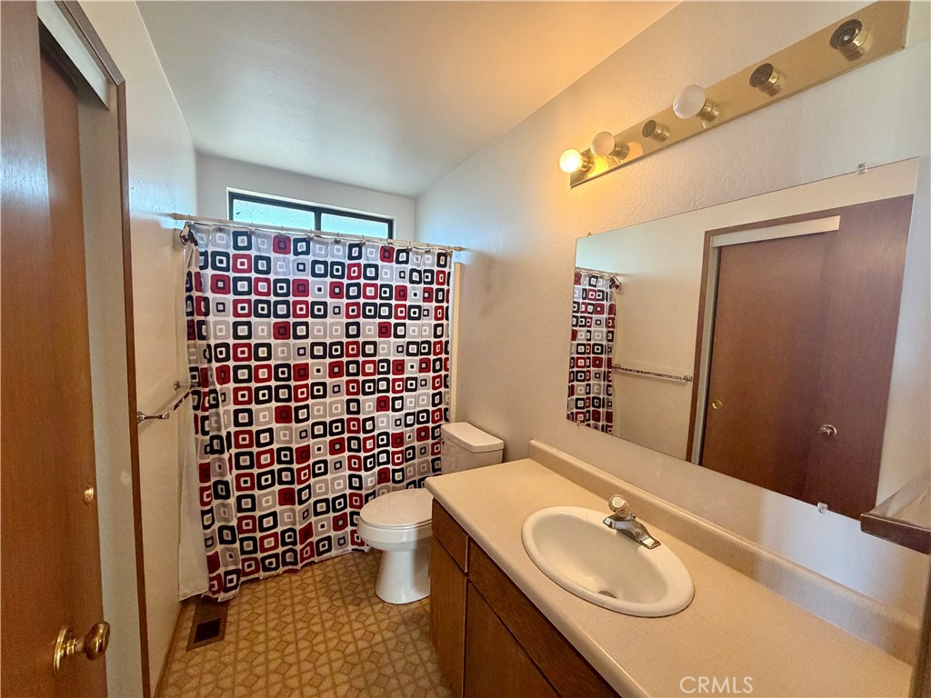 20764 Powder Horn Road Hidden Valley Lake, CA 95467 - Photo 16 of 27 a bathroom with a sink toilet and shower
