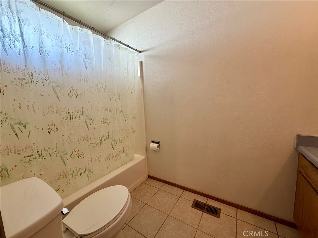 20764 Powder Horn Road Hidden Valley Lake, CA 95467 - Photo 17 of 27 a bathroom with a sink a toilet and shower