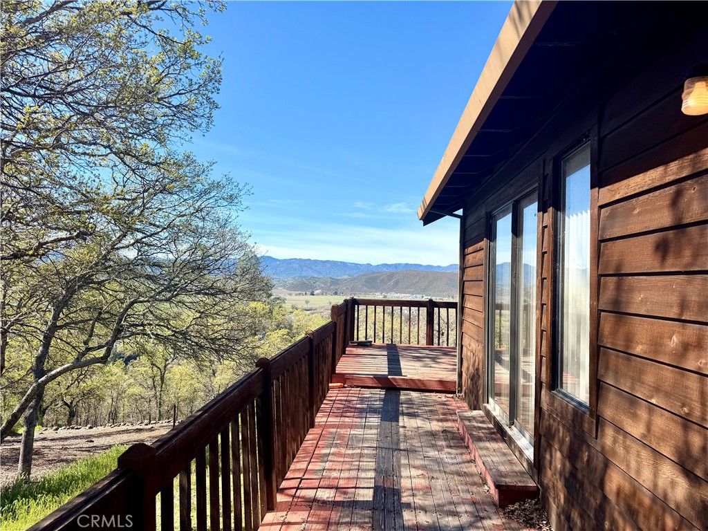20764 Powder Horn Road Hidden Valley Lake, CA 95467 - Photo 2 of 27 a view of balcony with wooden floor and fence