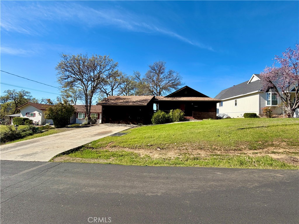 20764 Powder Horn Road Hidden Valley Lake, CA 95467 - Photo 26 of 27 a front view of a house with a yard and garage