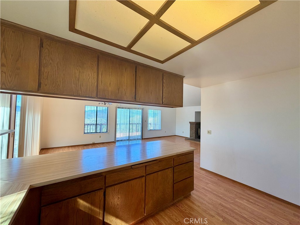 20764 Powder Horn Road Hidden Valley Lake, CA 95467 - Photo 10 of 27 a kitchen with stainless steel appliances wooden cabinets and a stove top oven
